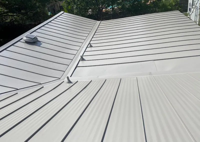 Solar attic fan installed on a metal roof for Roof Ventilation in Citrus Hills